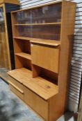 Mid-century modern teak lounge unit the top section with two sliding glass doors enclosing shelves