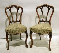 Set of four mahogany-framed chairs with moulded backs, serpentine fronted needlework upholstery