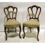 Set of four mahogany-framed chairs with moulded backs, serpentine fronted needlework upholstery