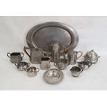 Hammered pewter oval tray, a three-piece hammered pewter teaset and various other pewter teawares