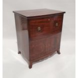 19th century mahogany commode converted to a television cabinet with lion mask handles, on swept