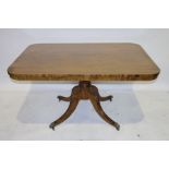 Georgian-style mahogany tilt-top table, the rectangular top with rounded corners, on turned column
