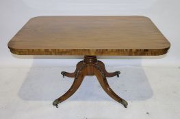 Georgian-style mahogany tilt-top table, the rectangular top with rounded corners, on turned column