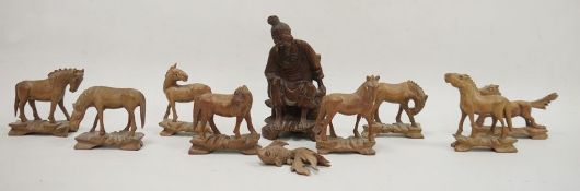 Chinese carved hardwood figure, 20th century together with eight carved wood models of horses and