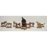 Chinese carved hardwood figure, 20th century together with eight carved wood models of horses and