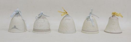 Five Lladro dated commemorative bells,  each tied with a little pink ribbon in white biscuit,