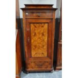 Continental walnut cupboard with single drawer above cupboard door, canted corners, on bun feet,