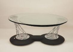 Modern designer coffee table, the circular top with swivelling out to reveal second swivelling