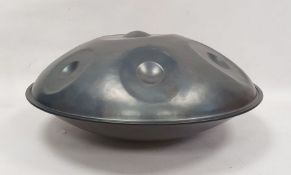 A steel handpan drum by Leigh Tolson of Stroud, tuned in the key of D minor, circular and elliptical