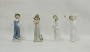 Four Lladro figures, printed impress marks, comprising: boy standing wearing dungarees beside an