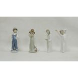Four Lladro figures, printed impress marks, comprising: boy standing wearing dungarees beside an