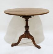 Georgian mahogany circular tripod table, the circular top on birdcage to turned pedestal and three