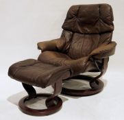 Ekornes brown leather reclining armchair and two footstools (3)  Condition Reportthe chair has had a