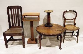 20th century mahogany circular table on cabriole legs, two oak slat back 20th century chairs, a