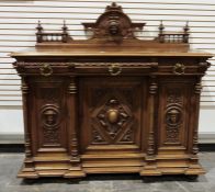Victorian mahogany Renaissance revival sideboard, the back board with carved jester's mask
