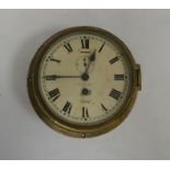 Henry Browne and Son Ltd brass case ship style clock with circular dial with Roman numerals, an