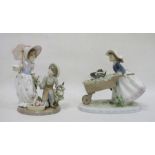 Two Lladro figures, printed impress marks, the first modelled as a girl pushing a wheelbarrow with