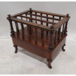 Victorian walnut and inlaid Canterbury of three sections, united by spindles, the whole on turned