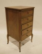 Mahogany bedside chest of four drawers on French cabriole supports brass hoof feet (one missing) (