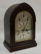 Late 19th / early 20th century mahogany cased bracket clock of lancet form, the chiming mechanism on