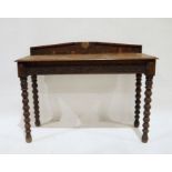 Probably Victorian oak side table, the rectangular top with moulded edge, carved frieze, on turned