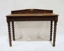 Probably Victorian oak side table, the rectangular top with moulded edge, carved frieze, on turned