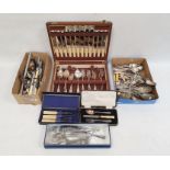 Collection of assorted flatware, including bone handled sets,  serving spoons, forks and carvers, an