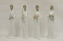 Four Lladro figures, printed impress marks, comprising: Unity No. 06377, Light and Fire, No.