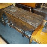 Possibly 18th century or later oak gateleg table, on turned block supports