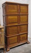 20th century mahogany cupboard, moulded cornice above four pairs of panelled doors on ogee bracket