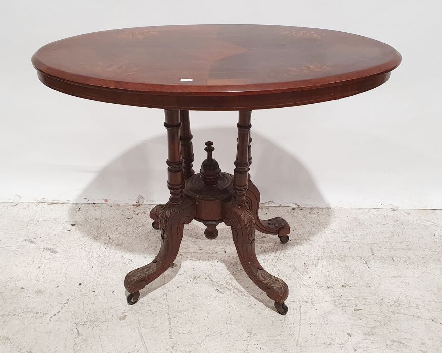 19th century walnut oval and inlaid occasional table on four turned column supports to ogee legs and