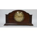 Modern mantel clock in mahogany casing, Arabic numerals to the dial, the mechanism marked 'Buren