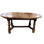 Stained elm extending dining table of revived 17th century-style, the oval top with extra leaf and