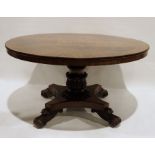 Early Victorian mahogany circular breakfast table on turned and carved column to quatrefoil base and