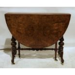 Early Victorian burr walnut Sutherland table on turned and carved end column supports to ogee