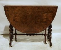 Early Victorian burr walnut Sutherland table on turned and carved end column supports to ogee