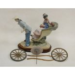 Lladro group of a Chinese girl in carriage, printed marks, the girl seated in a basket moulded