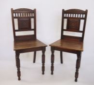 Pair of 19th century James Shoolbred mahogany hall chairs with carved shaped top rails above