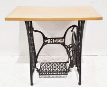 Beech top side table, the base is a Singer sewing machine treadle
