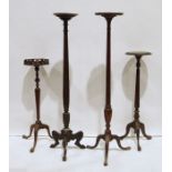 Four assorted jardiniere stands with turned and fluted/reeded or faceted columns, tripod bases,
