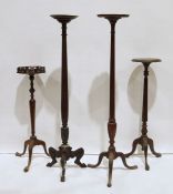 Four assorted jardiniere stands with turned and fluted/reeded or faceted columns, tripod bases,