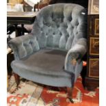 Late 19th/early 20th century low armchair in blue buttonback upholstery, on square section