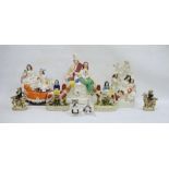 Group of Staffordshire and Staffordshire-style pottery figures, circa 1860 and later, including a