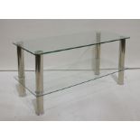 Two-tier glass television stand with chrome-effect supports