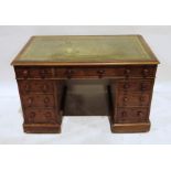 Late 19th century mahogany pedestal desk, the green leather inset top above nine drawers, on