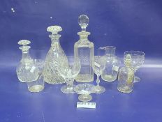 Collection of glassware including an engraved square-section spirit decanter and stopper, two others