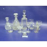 Collection of glassware including an engraved square-section spirit decanter and stopper, two others