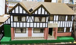 Large wooden doll's house together with a box of doll house furnitureCondition ReportThe