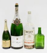 Large Bell's Old Scotch Whisky bottle, a Squire's gin bottle, Bollinger champagne magnum and a Pol