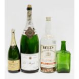 Large Bell's Old Scotch Whisky bottle, a Squire's gin bottle, Bollinger champagne magnum and a Pol